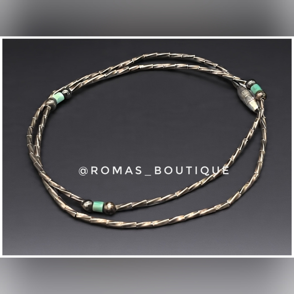 Vintage liquid silver necklace with turquoise beads.